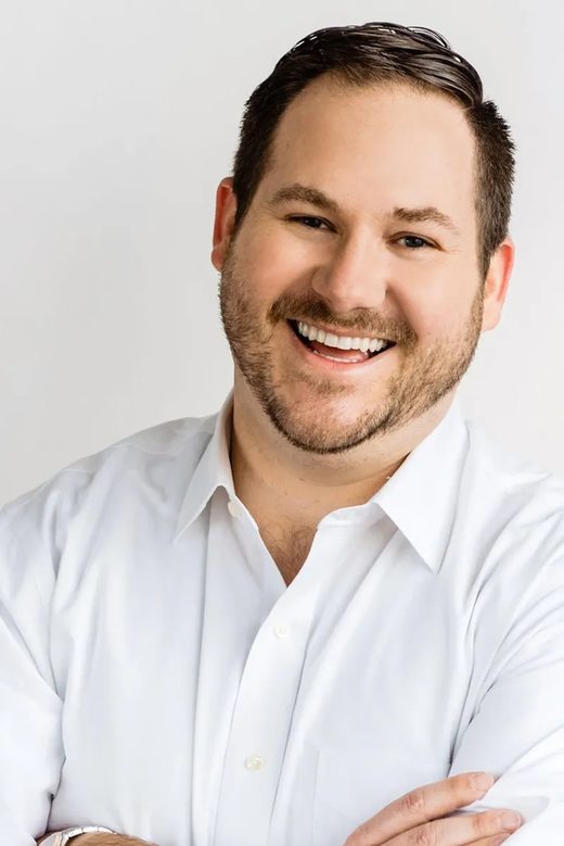 Nathan Bush smiling, arms crossed
